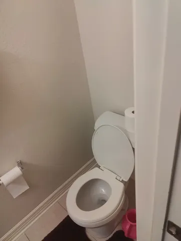 a bathroom with a toilet and a sink