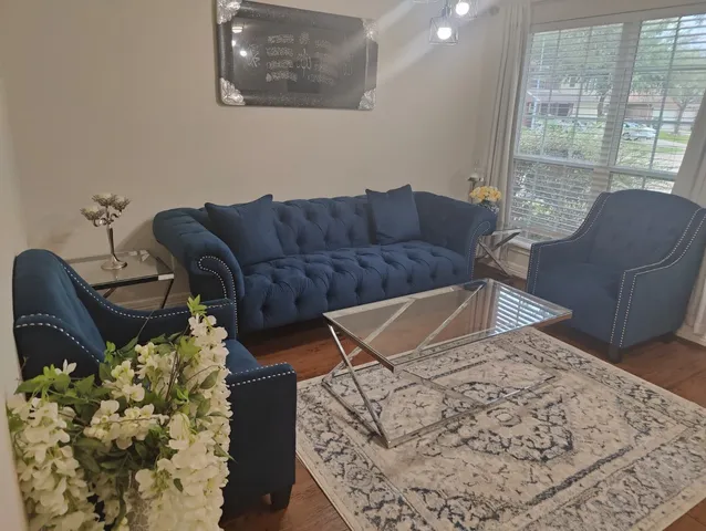 a living room with a couch and a large window