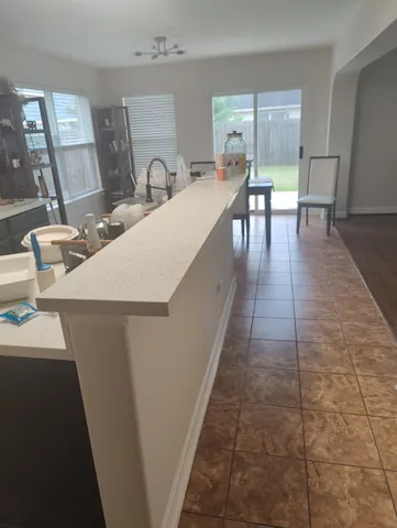 a dining room with table and chairs
