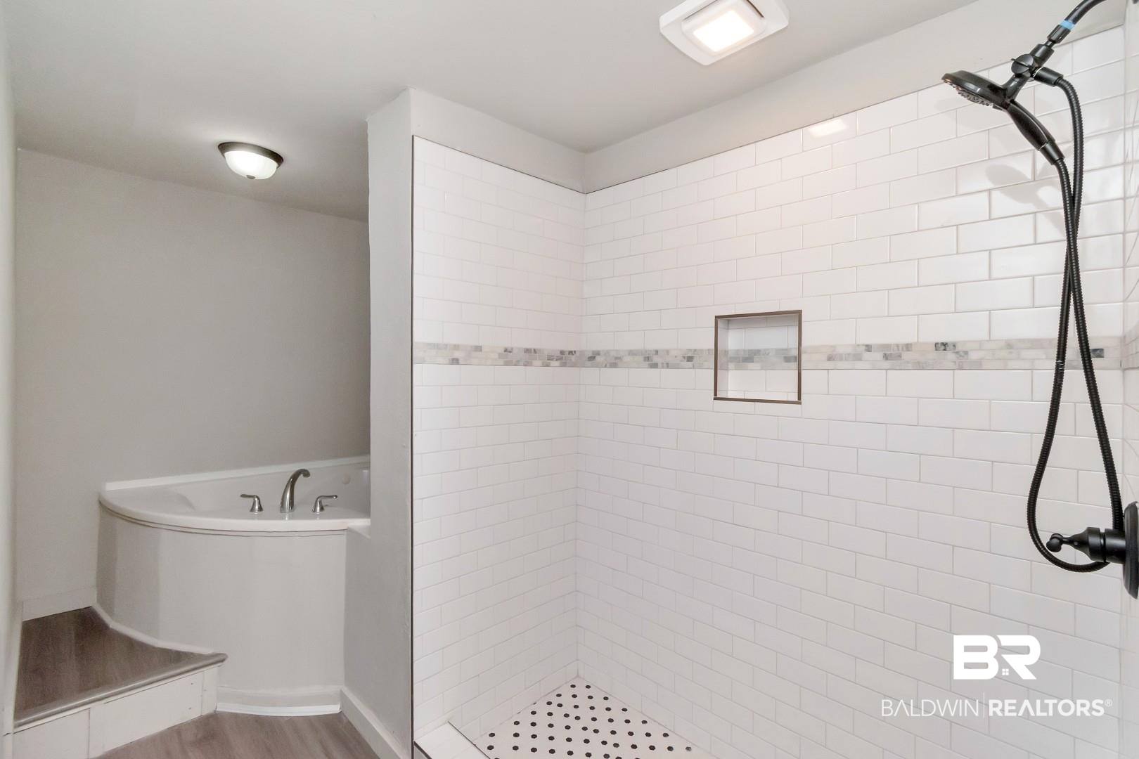 1334 Leroy Stevens Road Mobile, AL 36695 - Photo 30 of 46 Bathroom featuring a tile shower, a garden tub, and wood finished floors