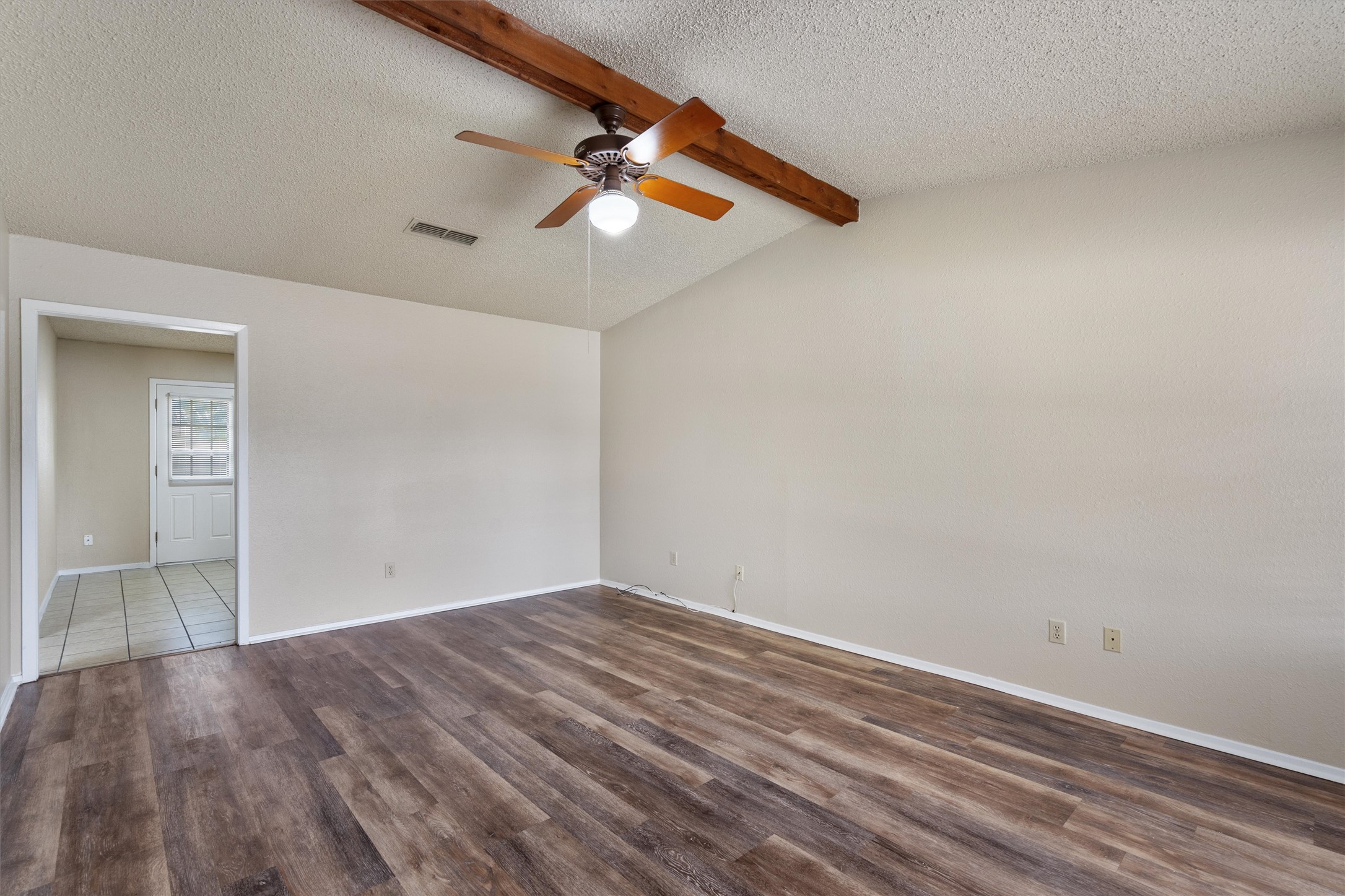 2805 Davis Street, Unit A Taylor, TX 76574 - Photo 3 of 12 a view of room with wooden floor and ceiling fan