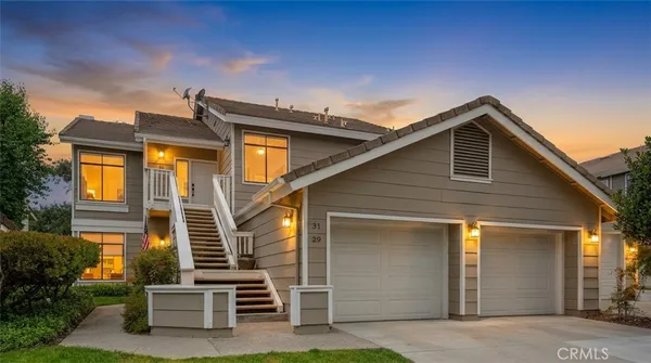 a front view of a house with stairs