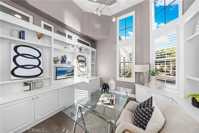 a bedroom with a bed and a large window with outer view