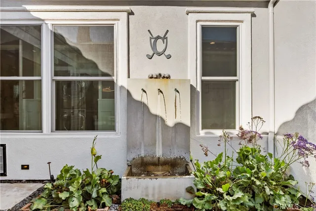 a view of a porch with a table and chairs