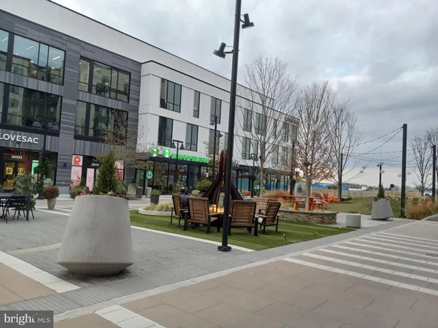 a outdoor space with lots of swings and slides