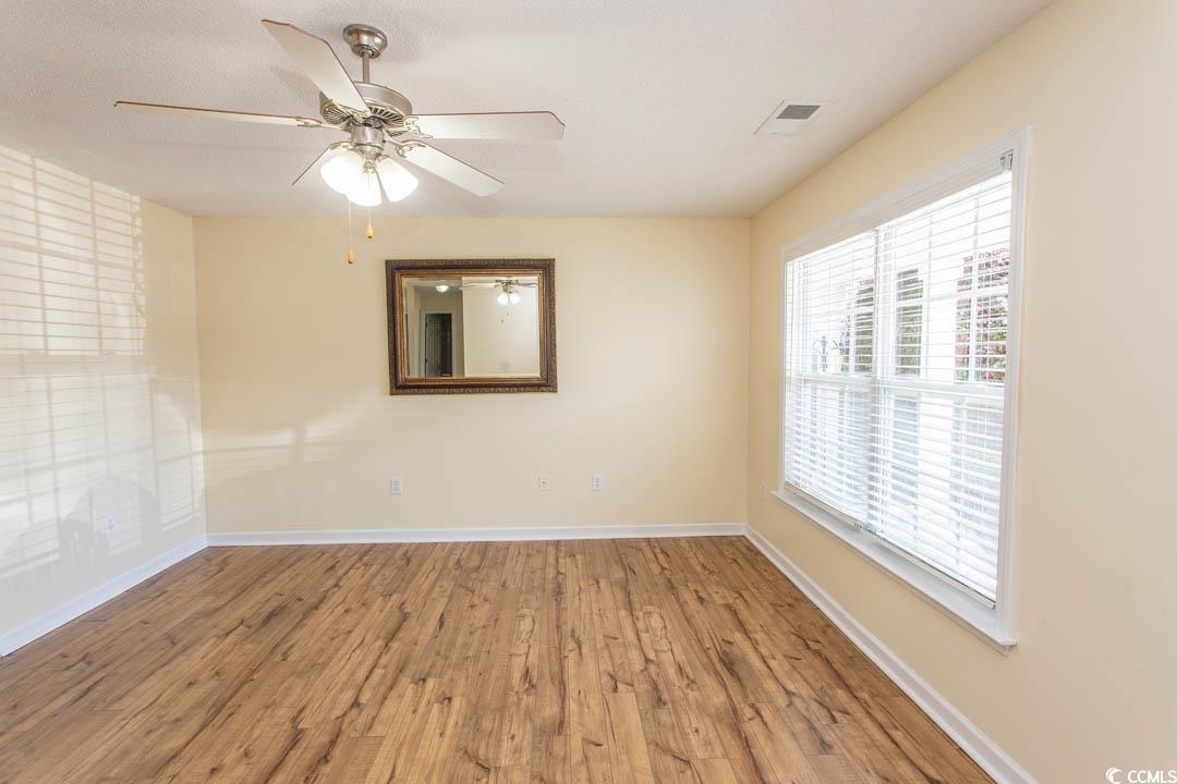 444 Andorra Street Longs, SC 29568 - Photo 3 of 40 Spare room featuring ceiling fan and hardwood / wo