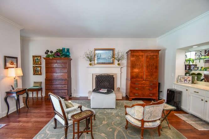 2901 Club Place Gainesville, GA 30506 - Photo 24 of 57 a living room with furniture a fireplace and next to windows