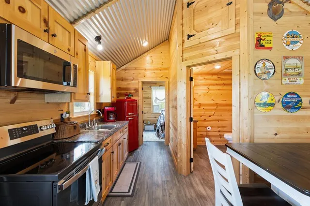a kitchen with a large stove a sink and a refrigerator