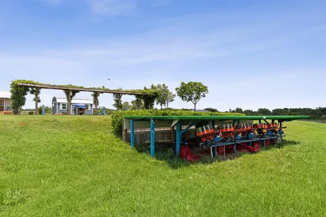 a view of a swimming pool and outdoor seating
