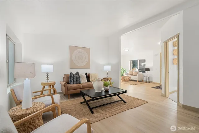 a living room with furniture and a table
