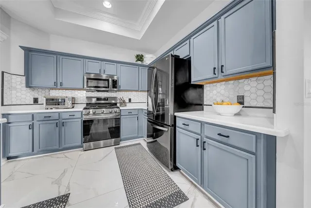 a living room filled with furniture and a potted plant