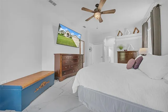 a view of a kitchen with refrigerator and furniture