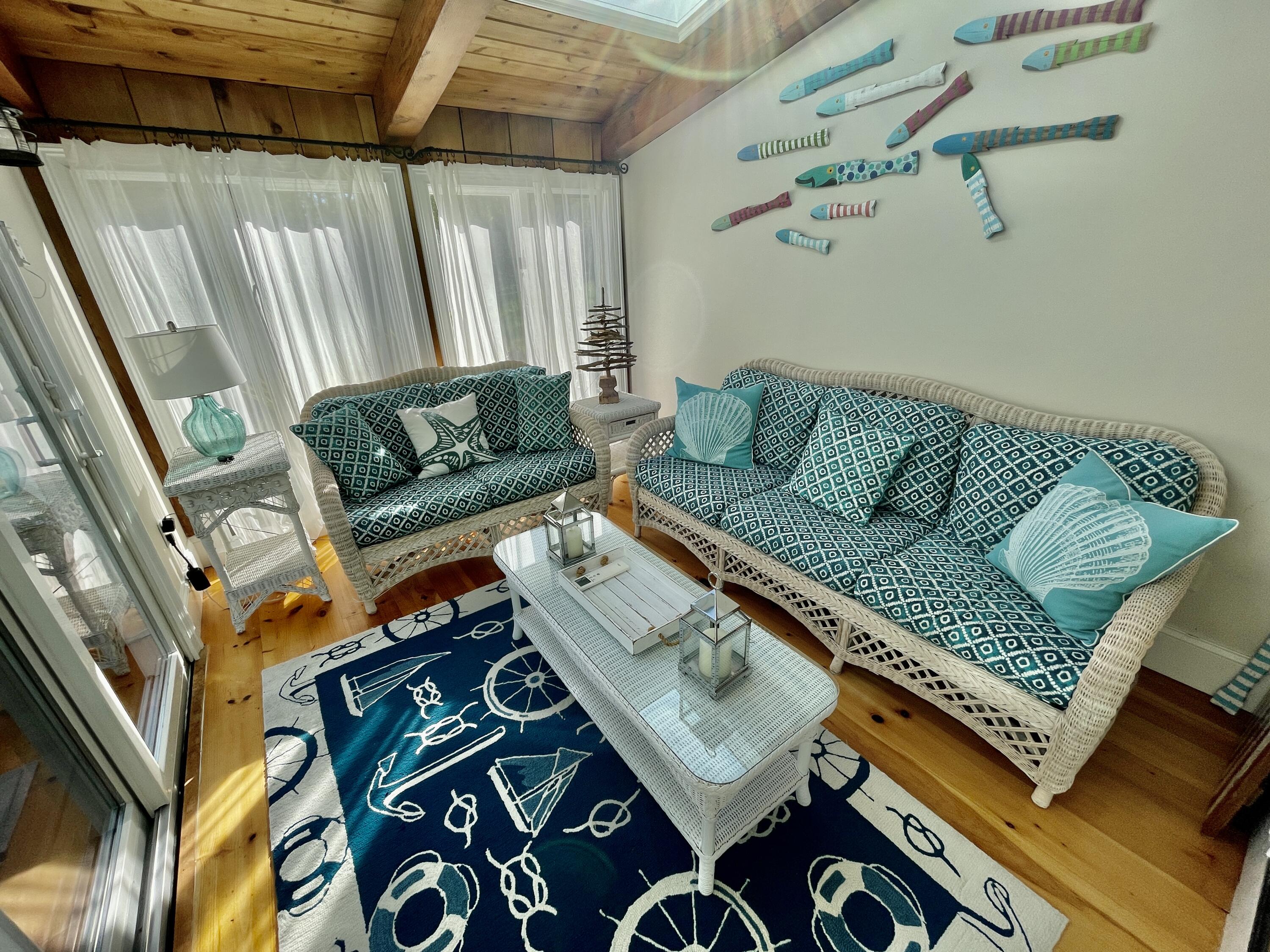 51 Beach Road Orleans, MA 02653 - Photo 13 of 46 a living room with furniture and a couch