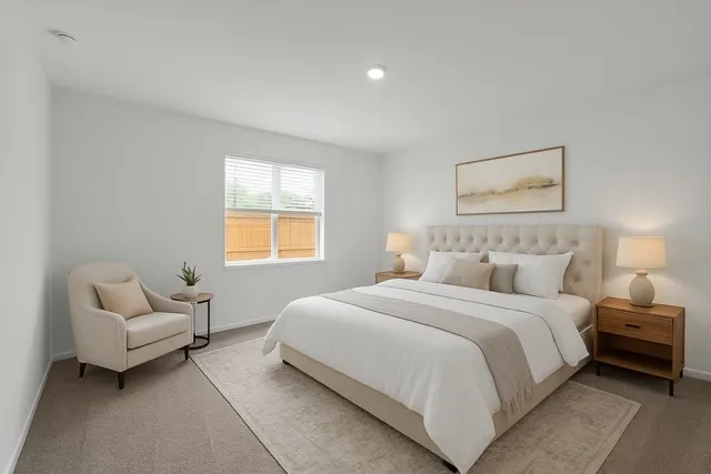 a bedroom with a bed and a couch