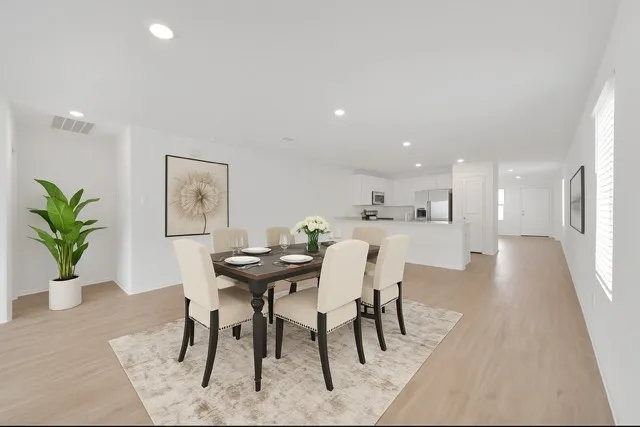 a view of a dining room with furniture
