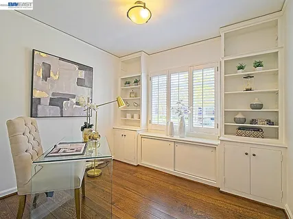 a bedroom with a bed and lamp with table