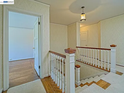 a dining room with furniture and windows