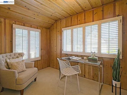 a view of empty room with wooden floor and cabinet