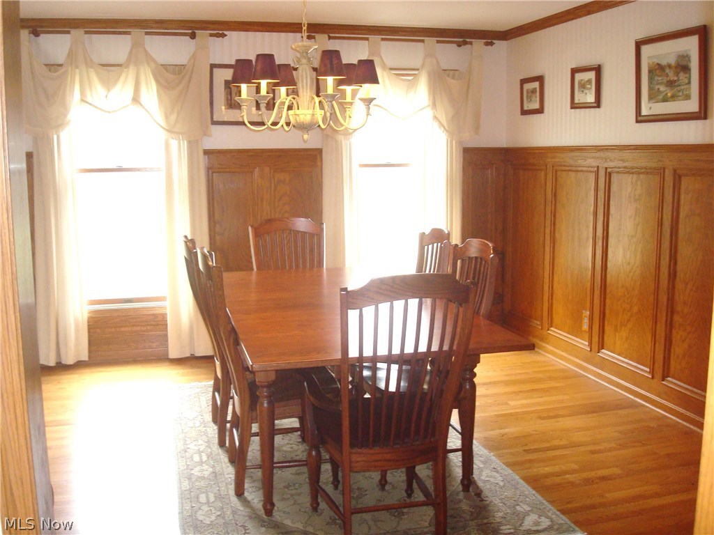 1733 Johns Road Clinton, OH 44216 - Photo 17 of 32 12 x 20 formal dining room, features 5' wainscoting and the same, 3/4" hardwood flooring as shown in the kitchen, dinette and foyer