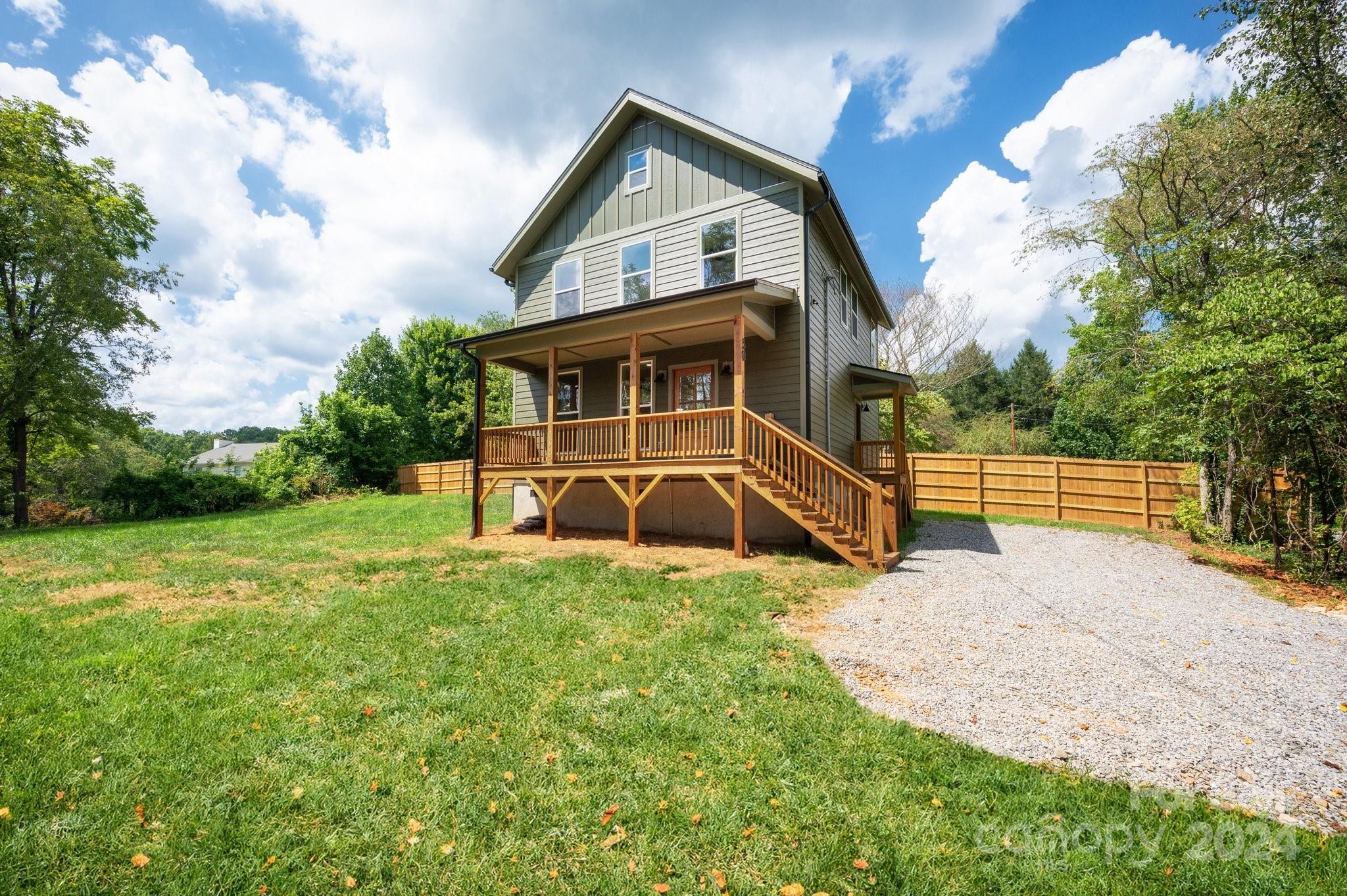 a view of backyard with a garden and entertaining space