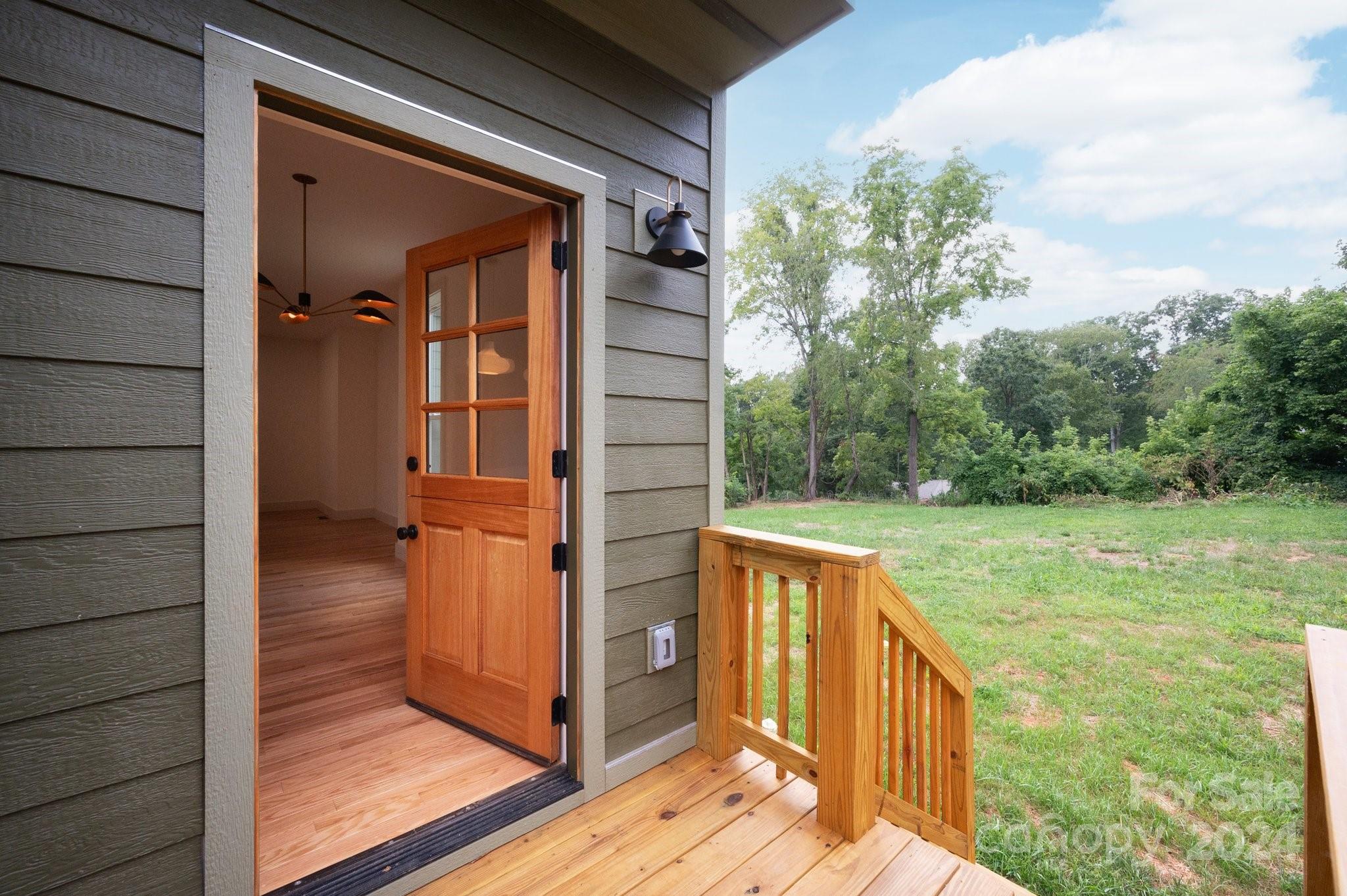 30 Spaulding Road Candler, NC 28715 - Photo 14 of 44 a view of a balcony with wooden floor and fence