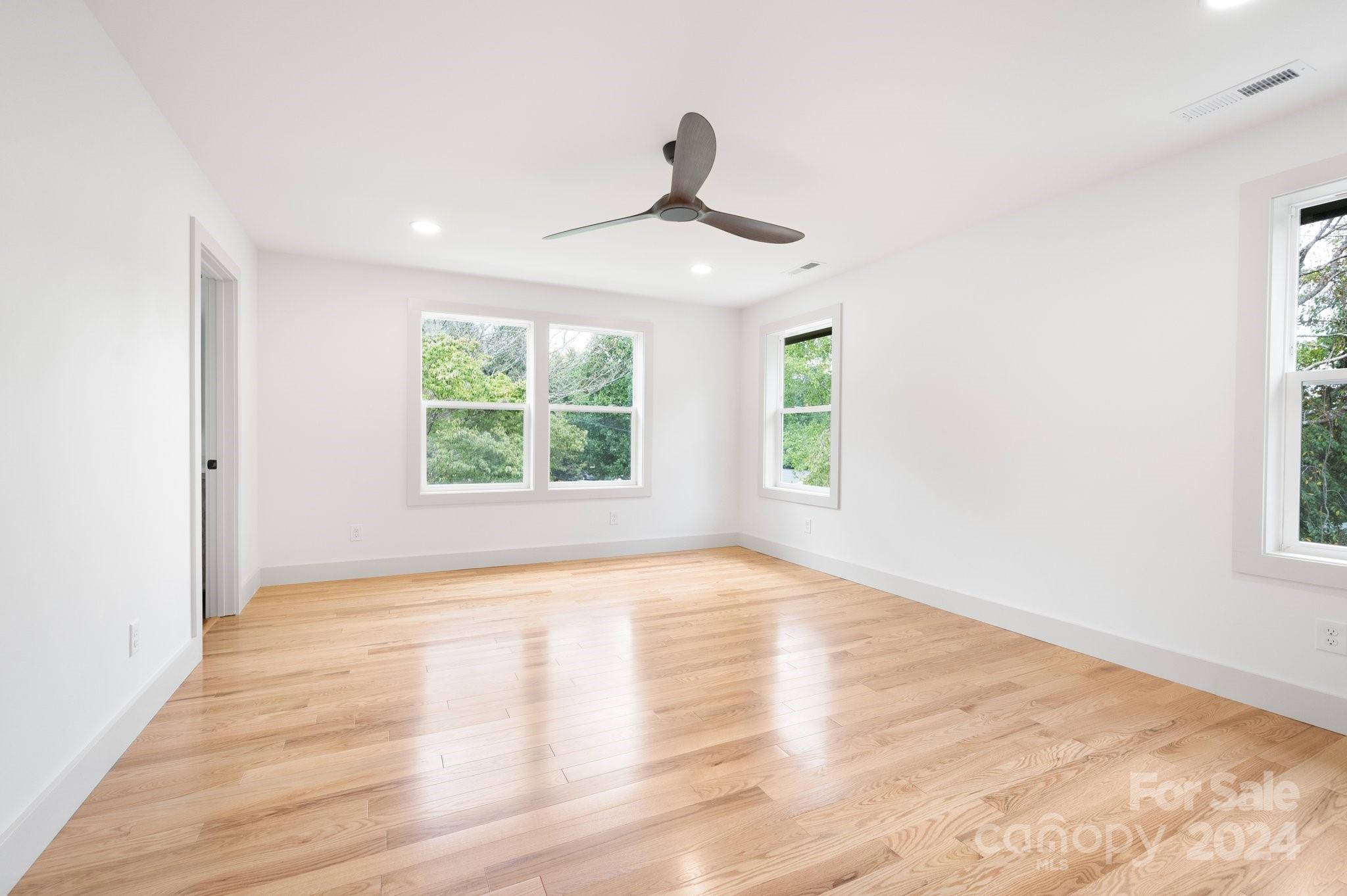 30 Spaulding Road Candler, NC 28715 - Photo 20 of 44 a view of an empty room with wooden floor and a window