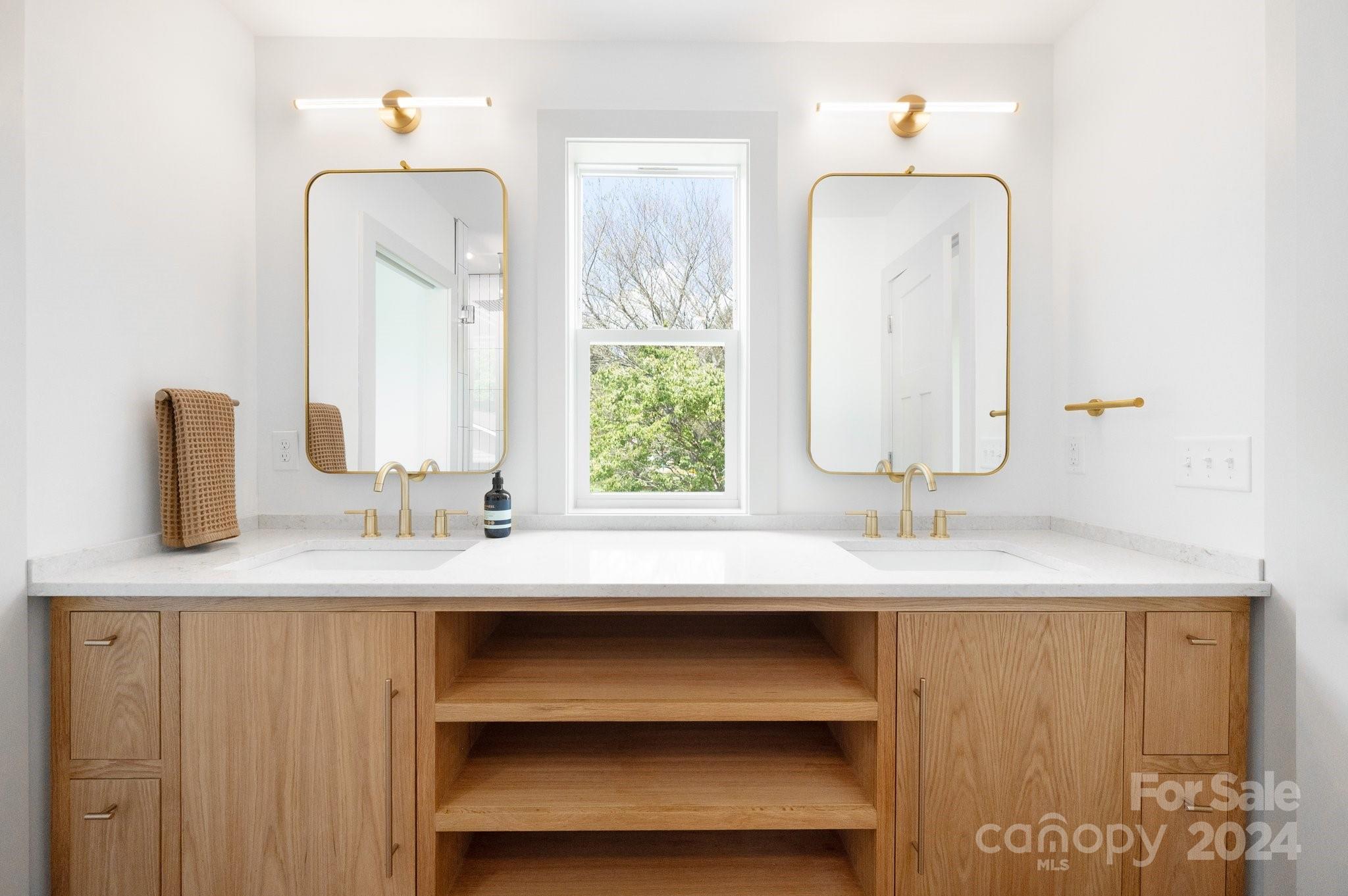 30 Spaulding Road Candler, NC 28715 - Photo 22 of 44 a bathroom with a sink vanity and a mirror