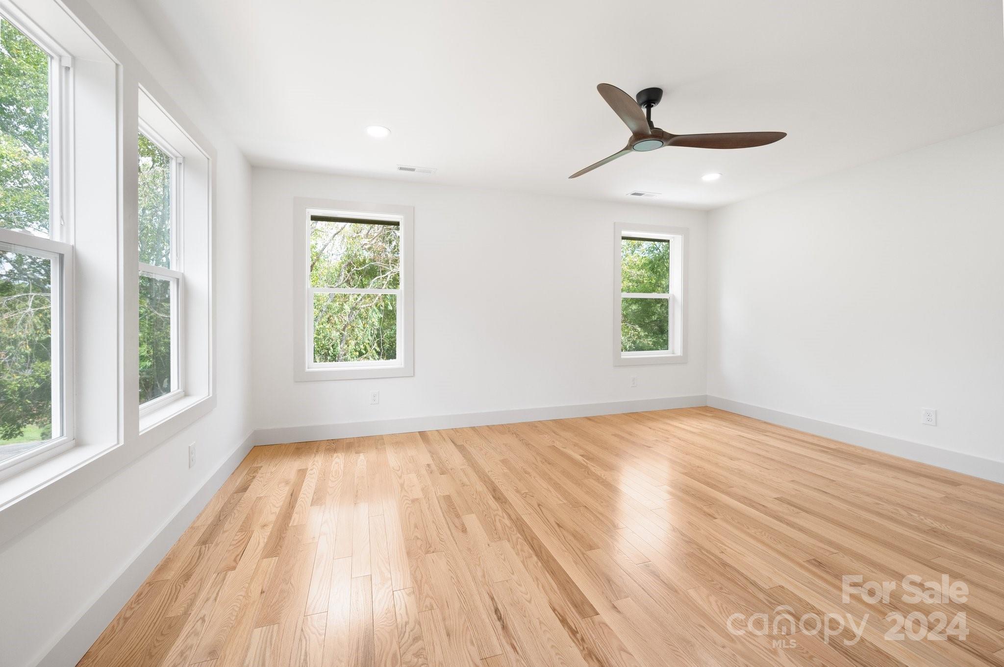 30 Spaulding Road Candler, NC 28715 - Photo 24 of 44 a view of empty room with wooden floor and fan
