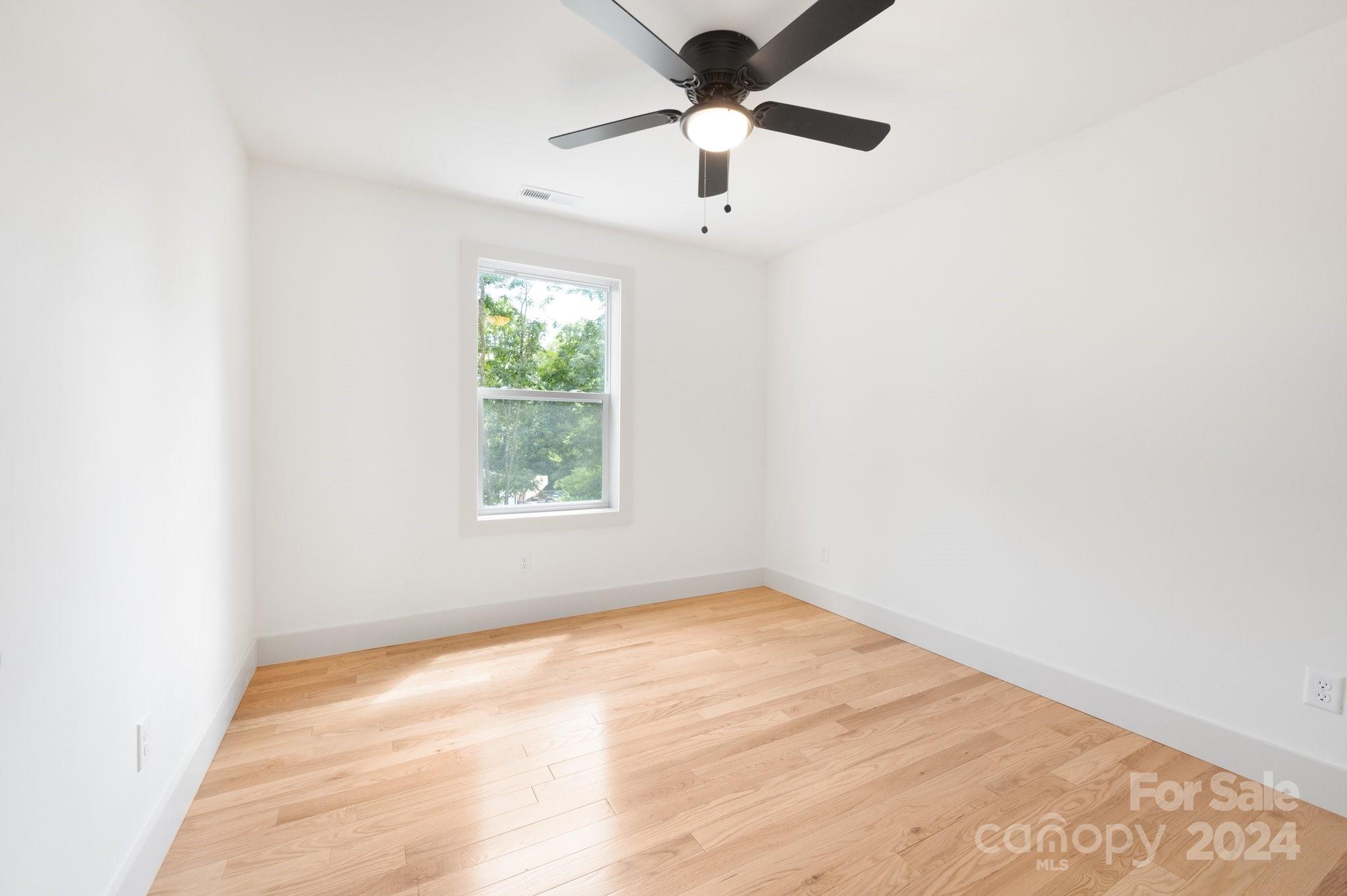 30 Spaulding Road Candler, NC 28715 - Photo 25 of 44 an empty room with a window and a fan