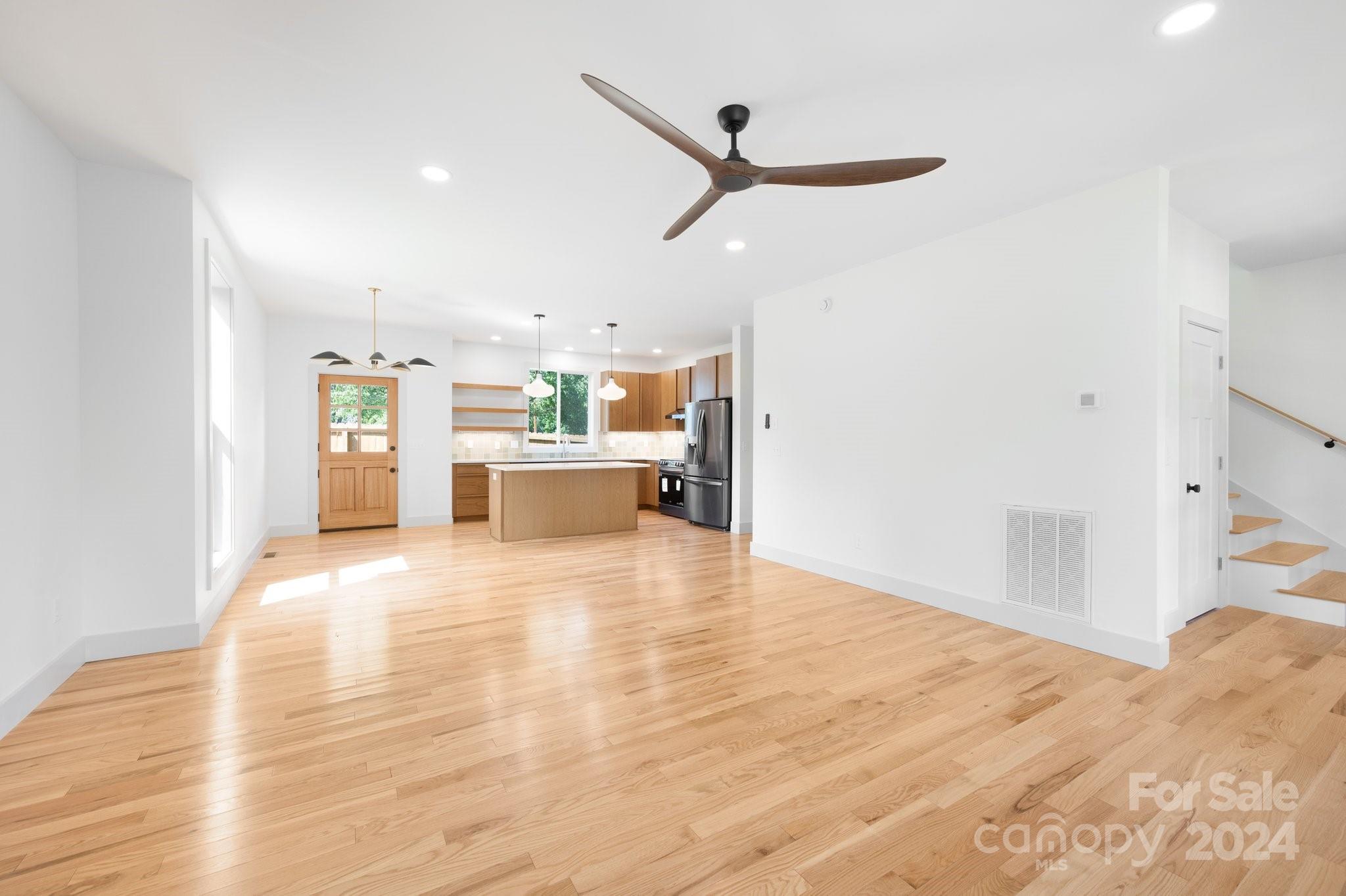30 Spaulding Road Candler, NC 28715 - Photo 3 of 44 a view of a kitchen with a sink and a refrigerator