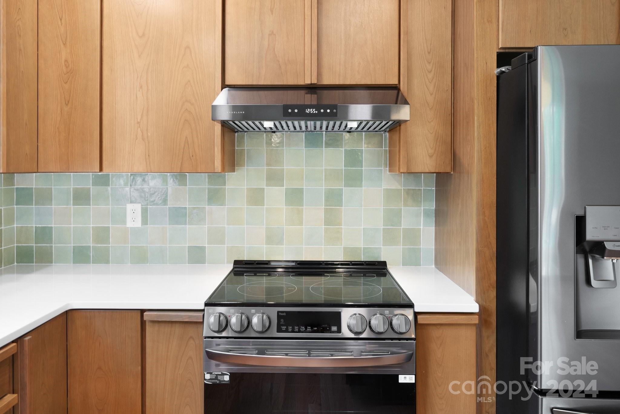 30 Spaulding Road Candler, NC 28715 - Photo 8 of 44 a kitchen with a stove and a cabinet