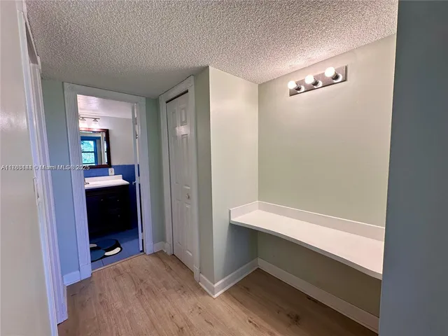 a view of room with walk in closet and bathroom