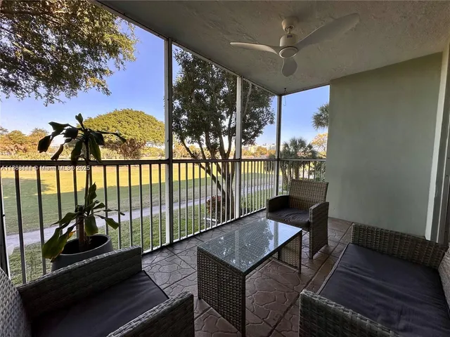 a view of a balcony with chairs