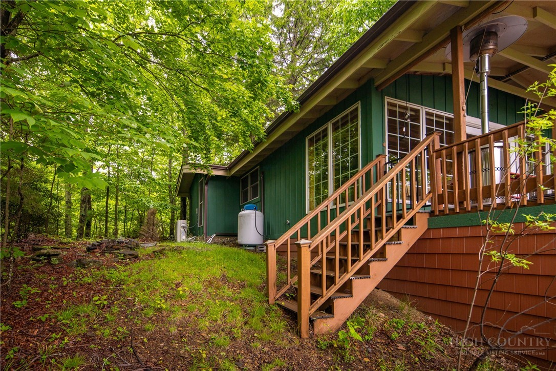 280 Chinkapin Ridge Road Seven Devils, NC 28604 - Photo 29 of 40 a view of backyard with deck and wooden fence