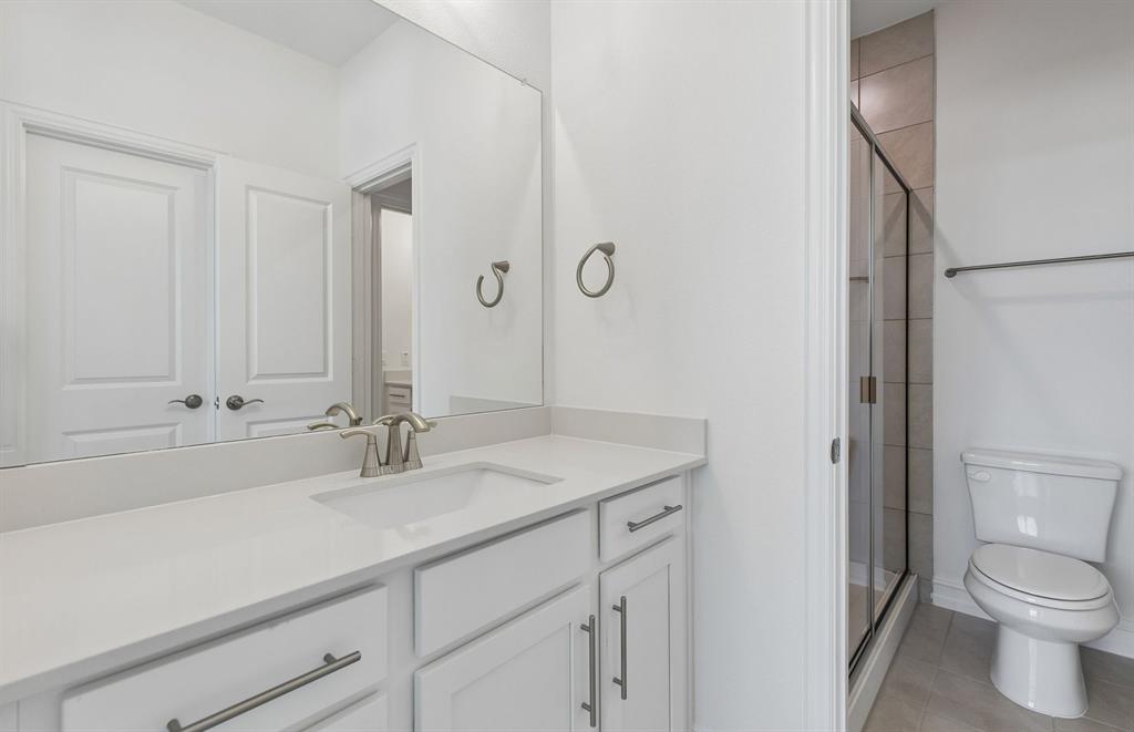 11220 Abbotsbury Road Fort Worth, TX 76052 - Photo 24 of 32 a bathroom with a sink toilet and shower