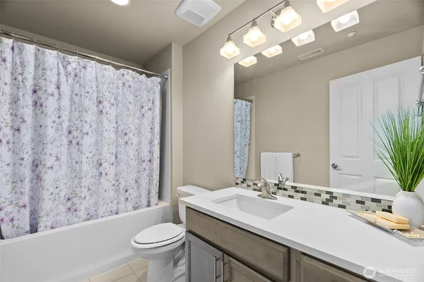 a view of a hallway with washer and dryer