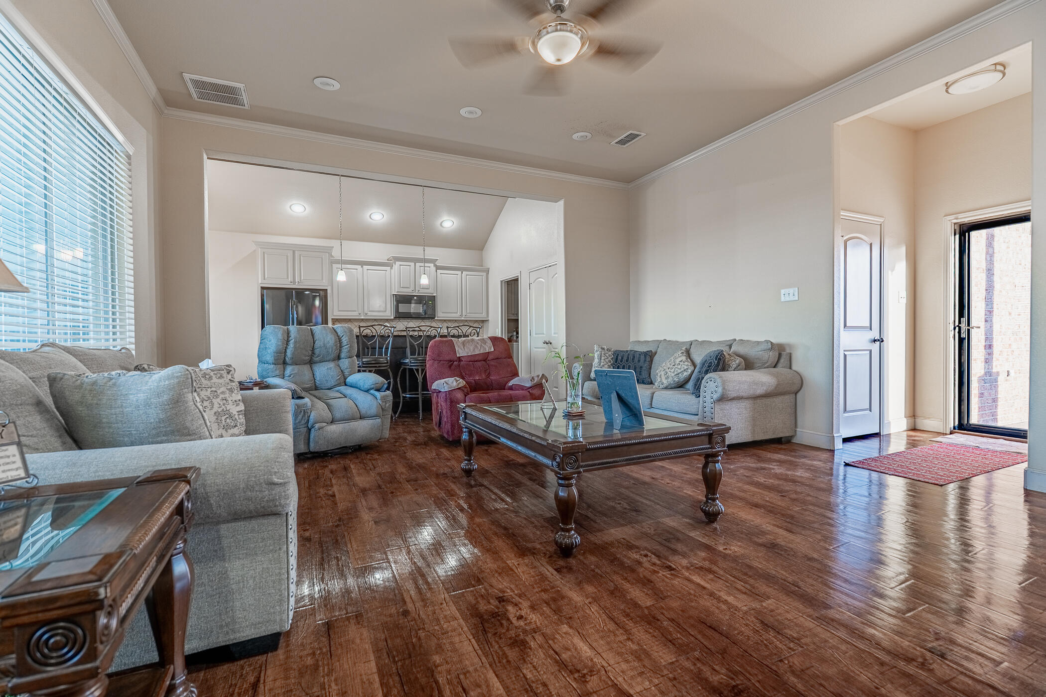 1620 Farm To Market 41 Lubbock, TX 79423 - Photo 13 of 37 a living room with furniture and a wooden floor