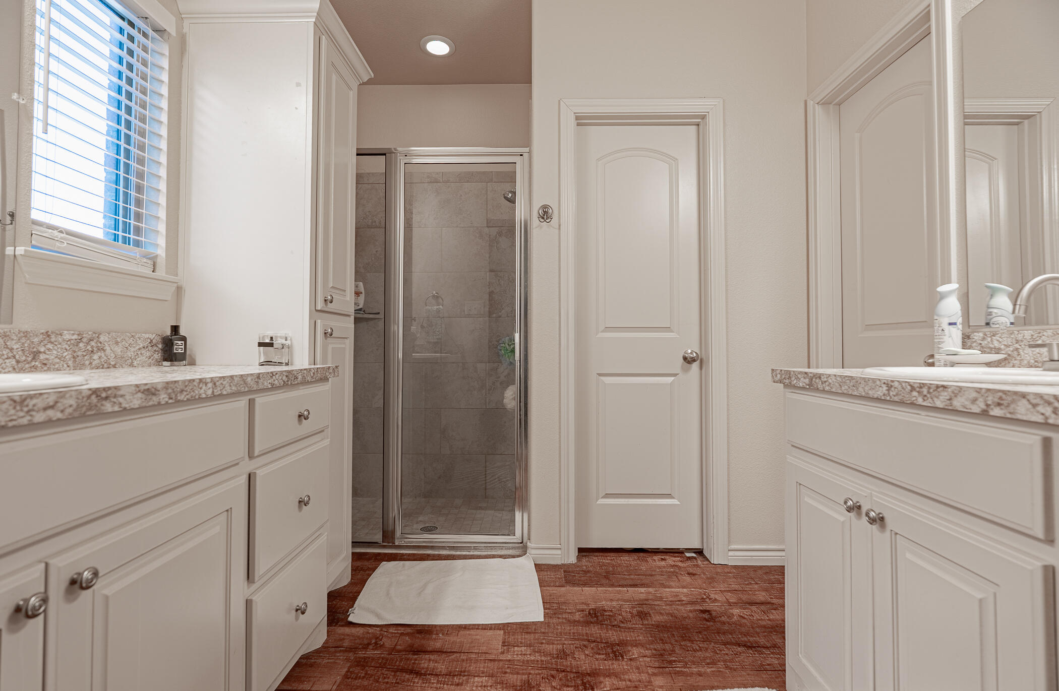 1620 Farm To Market 41 Lubbock, TX 79423 - Photo 29 of 37 a bathroom with a shower sink and mirror