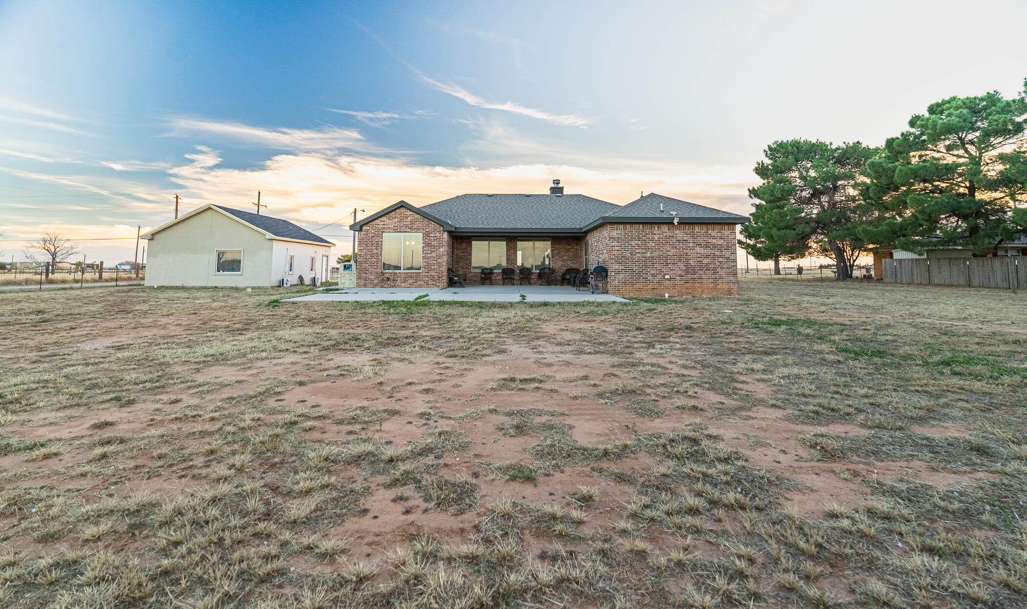 1620 Farm To Market 41 Lubbock, TX 79423 - Photo 35 of 37 a big house with a big yard and large trees
