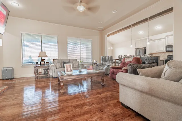 a view of a house with a yard and sitting area