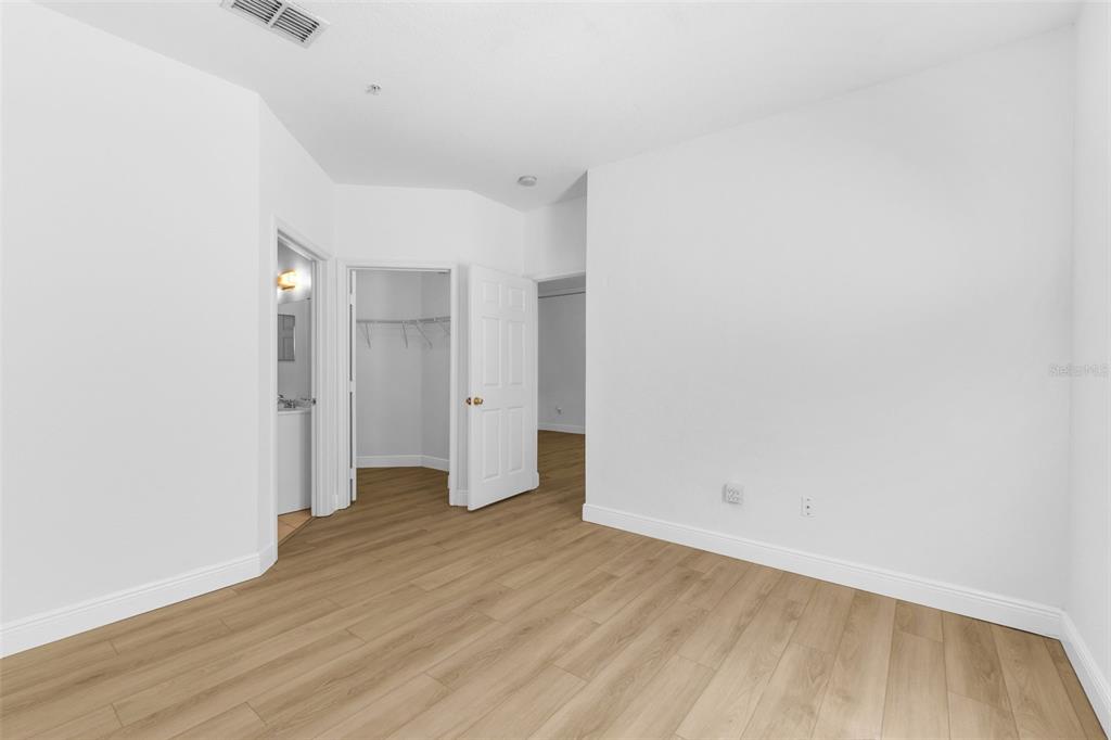 3561 Conroy Road, Unit 216 Orlando, FL 32839 - Photo 16 of 32 a view of an empty room with wooden floor