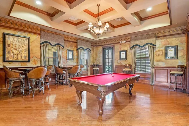 a view of a swimming pool with a table and chairs