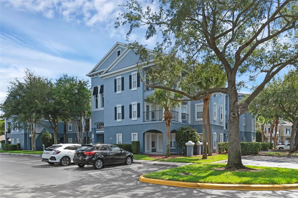 3561 Conroy Road, Unit 216 Orlando, FL 32839 - Photo 3 of 32 a car parked in front of a brick house