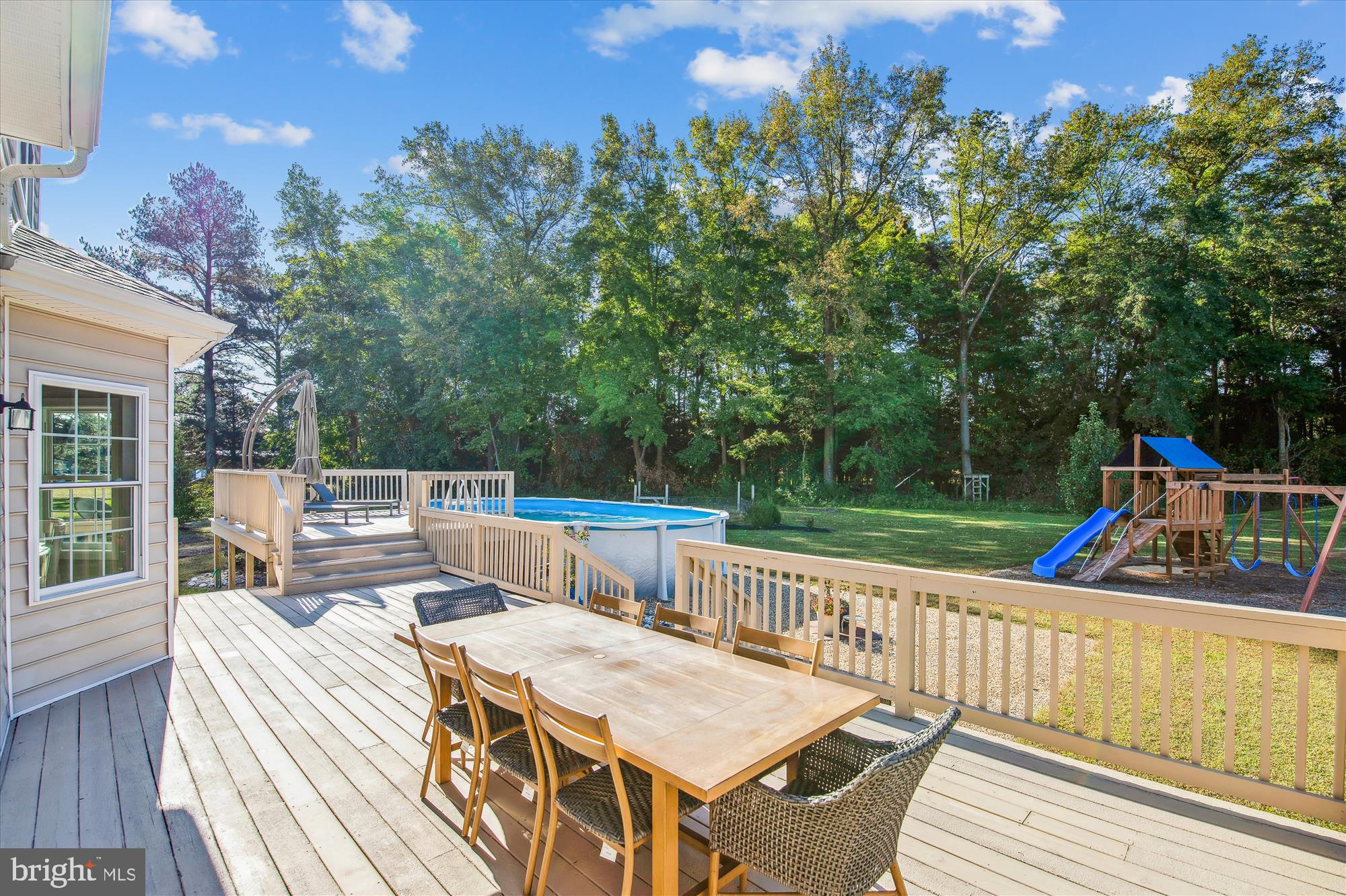 9044 Davis Road Pittsville, MD 21850 - Photo 22 of 43 a view of a deck with two chairs and a table