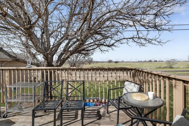 a view of a chairs and table on the terrace
