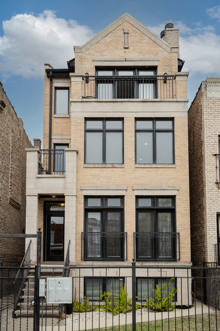 6543 South Ingleside Avenue, Unit 2 Chicago, IL 60637 - Photo 1 of 15 a front view of a house with a glass door