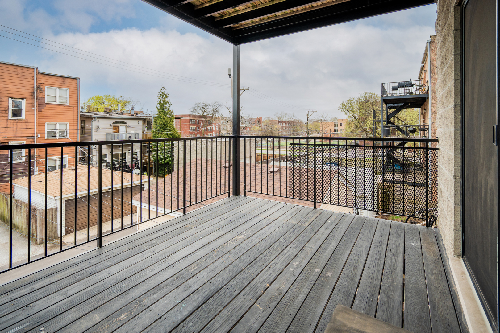 6543 South Ingleside Avenue, Unit 2 Chicago, IL 60637 - Photo 13 of 15 a view of a balcony with wooden floor