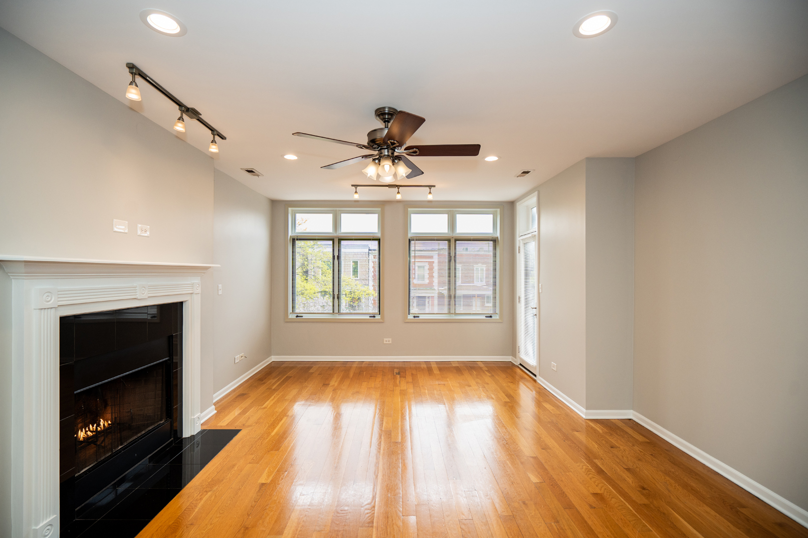 6543 South Ingleside Avenue, Unit 2 Chicago, IL 60637 - Photo 2 of 15 wooden floor in an empty room with a window