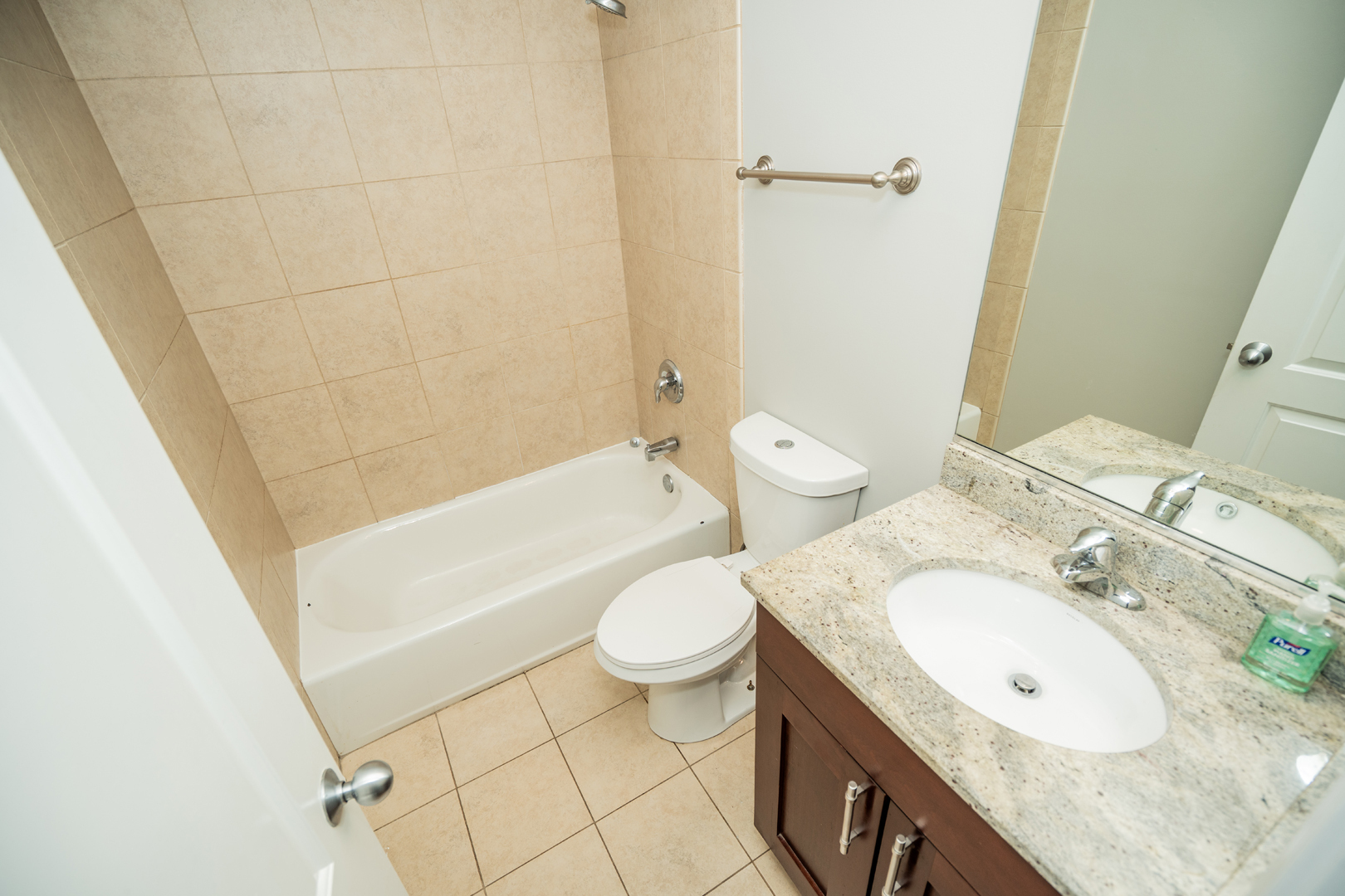 6543 South Ingleside Avenue, Unit 2 Chicago, IL 60637 - Photo 8 of 15 a bathroom with a granite countertop sink toilet and shower