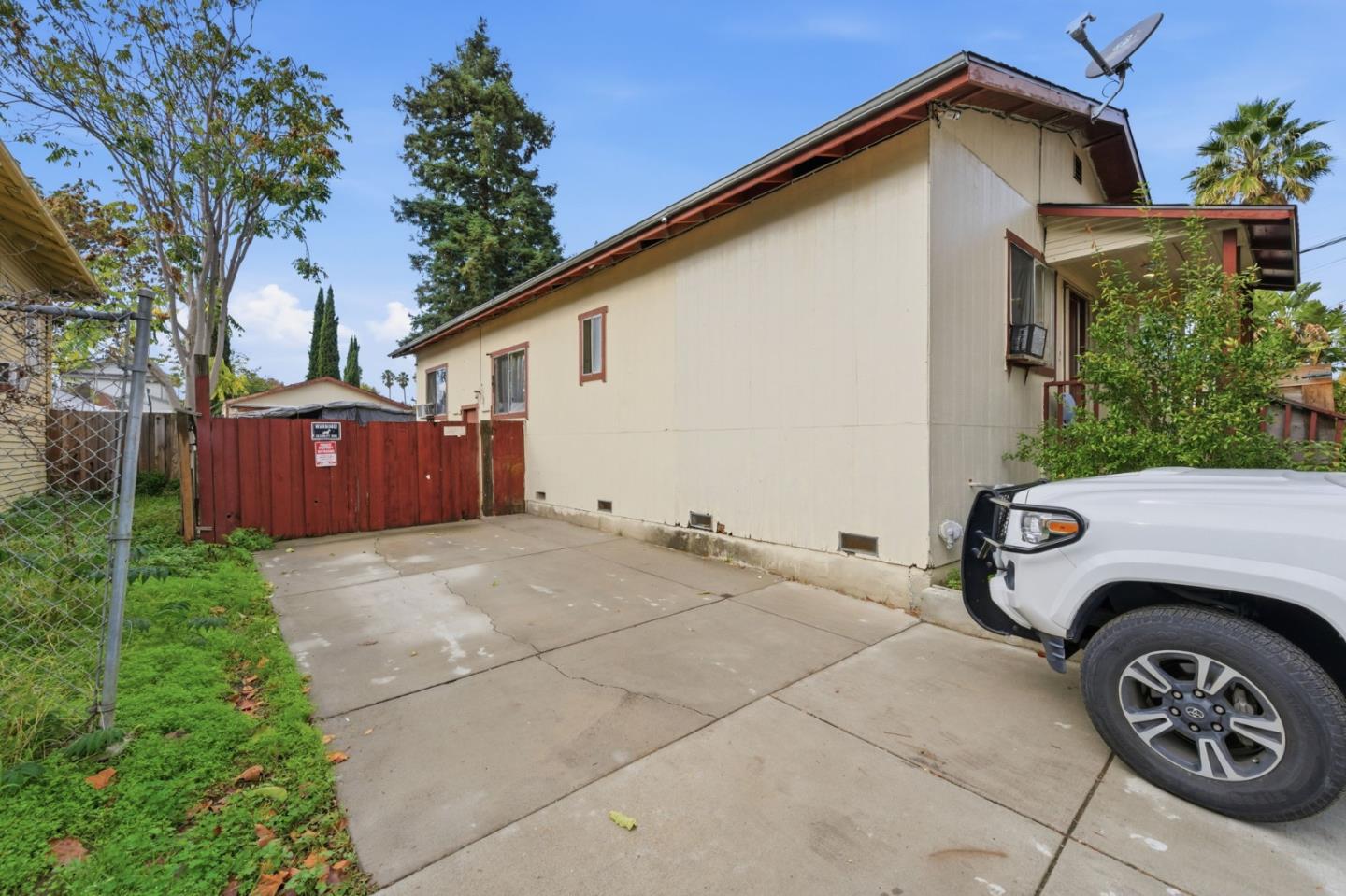 361 North 10th Street San Jose, CA 95112 - Photo 14 of 14 a view of garage and a car parked in a yard